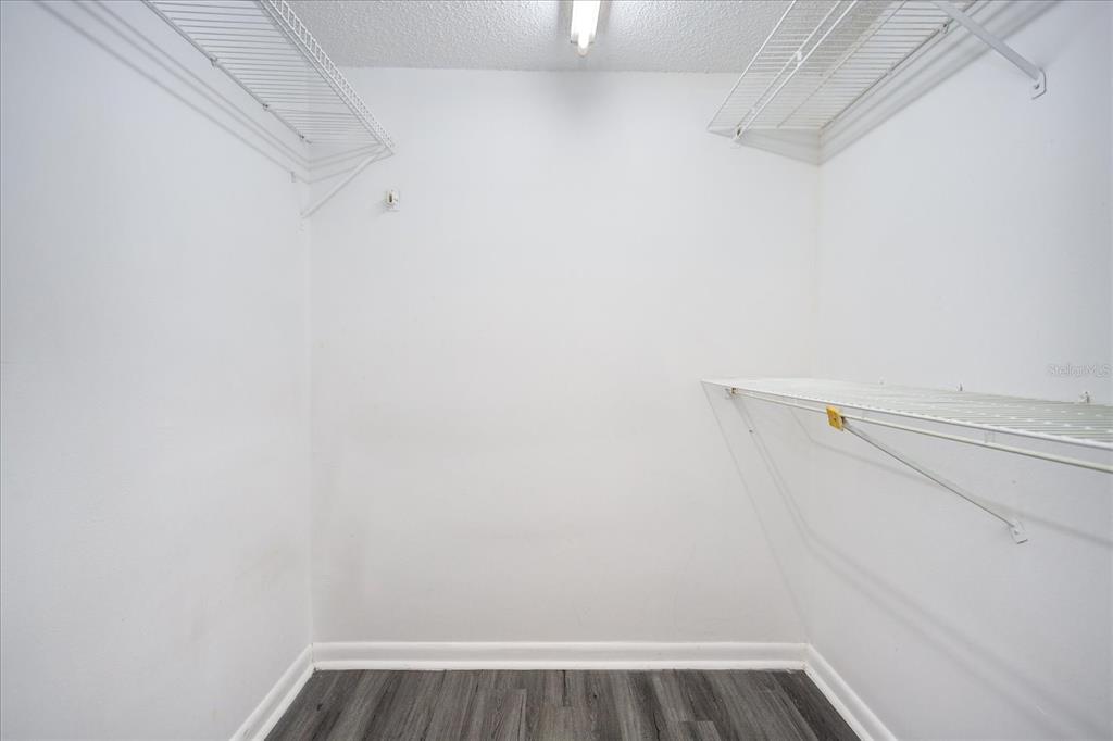 5013 Vineland Road, Unit 108 Orlando, FL 32811 - Photo 16 of 20 a view of a room with racks on the wall