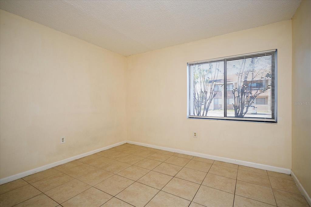 5013 Vineland Road, Unit 108 Orlando, FL 32811 - Photo 17 of 20 an empty room with windows