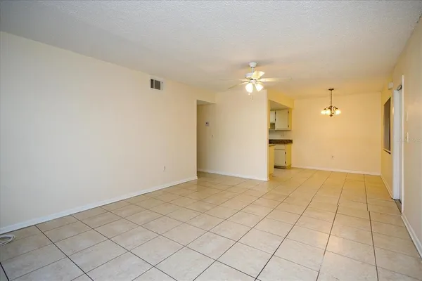 a view of an empty room and fire place
