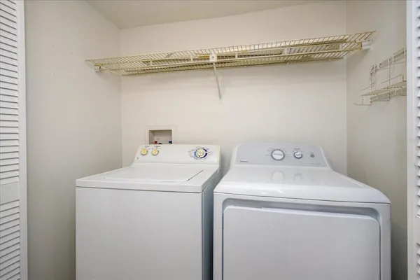 a utility room with dryer and washer