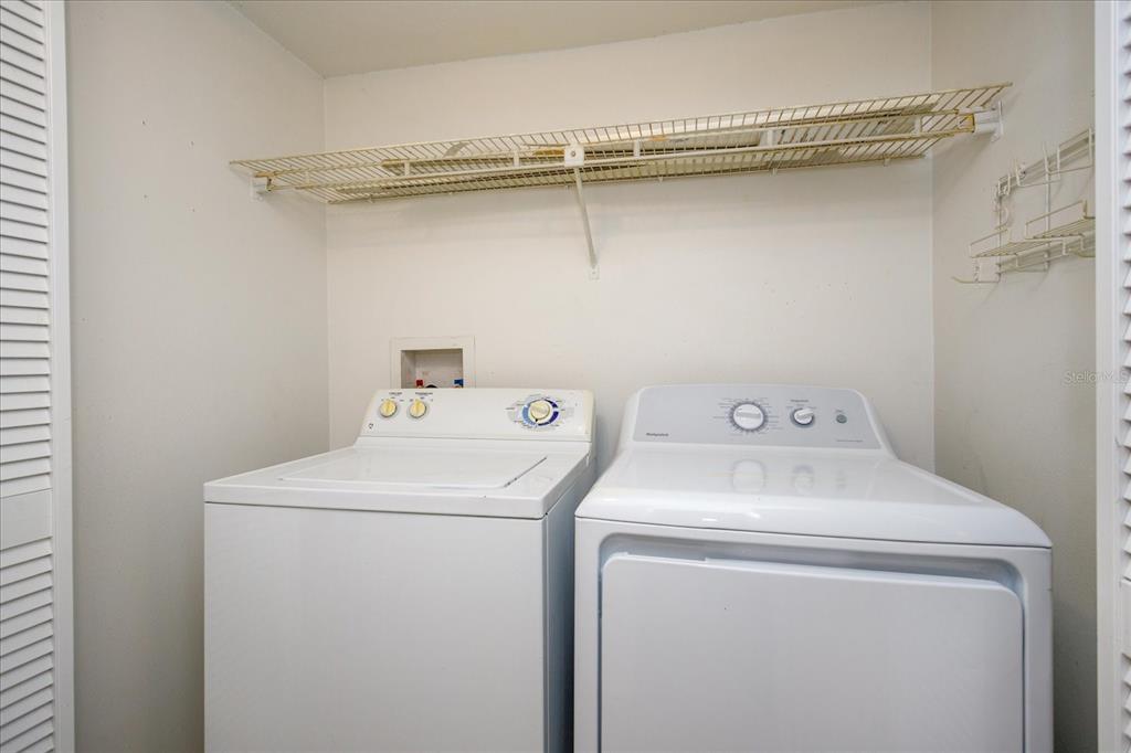 5013 Vineland Road, Unit 108 Orlando, FL 32811 - Photo 10 of 20 a utility room with dryer and washer