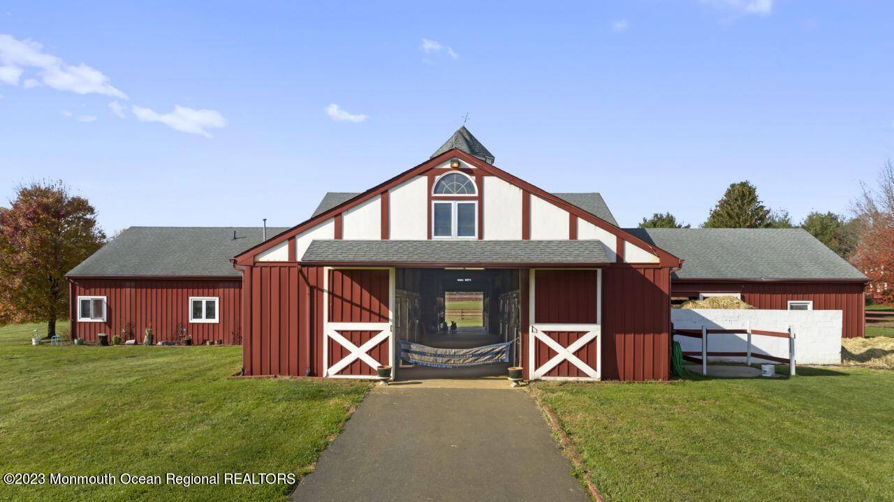 111 Muhlenbrink Road Colts Neck, NJ 07722 - Photo 13 of 73 a front view of a house with garden
