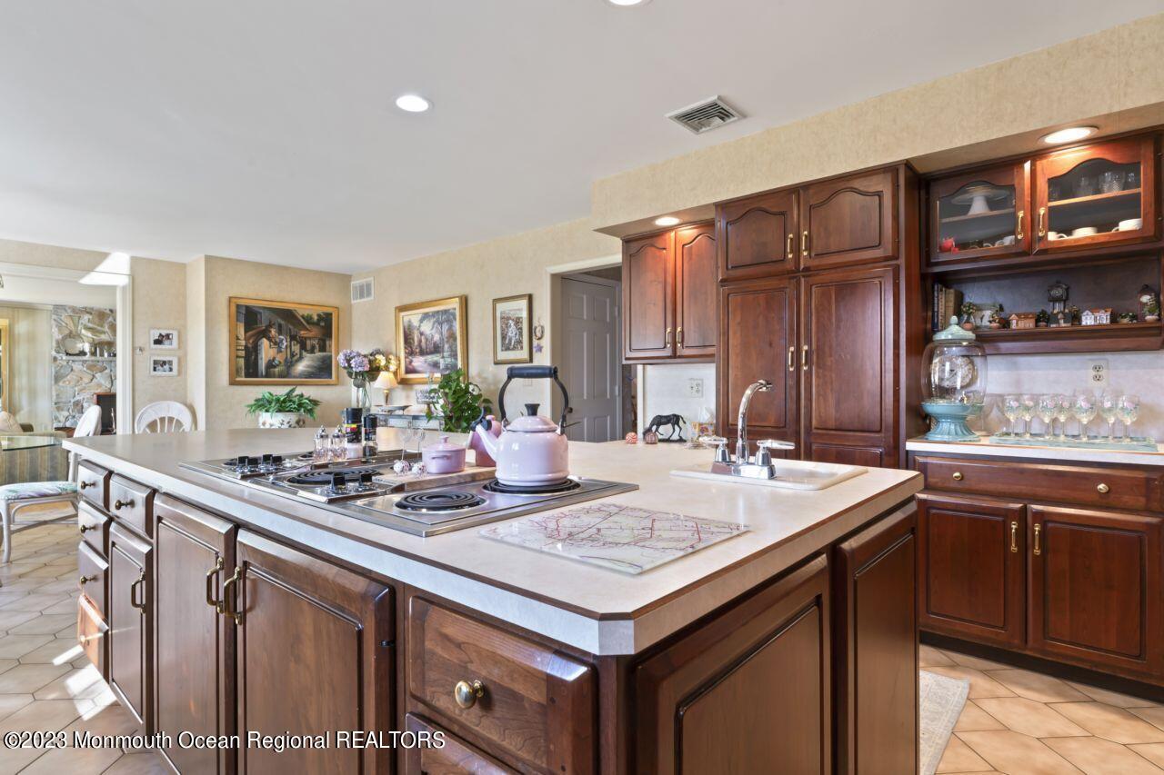 111 Muhlenbrink Road Colts Neck, NJ 07722 - Photo 25 of 73 a kitchen with sink stove and cabinets