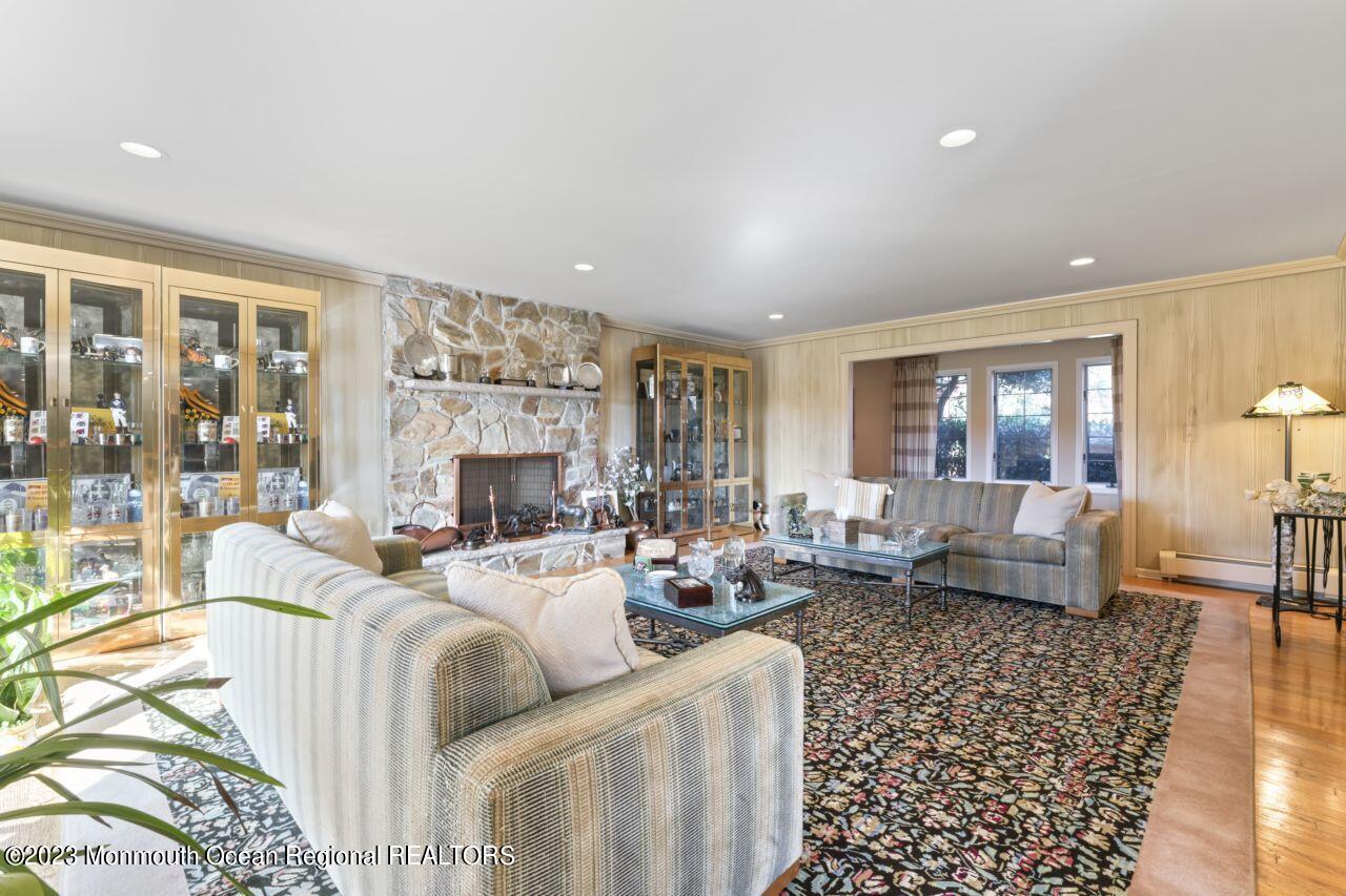 111 Muhlenbrink Road Colts Neck, NJ 07722 - Photo 29 of 73 a living room with furniture fireplace and a large window