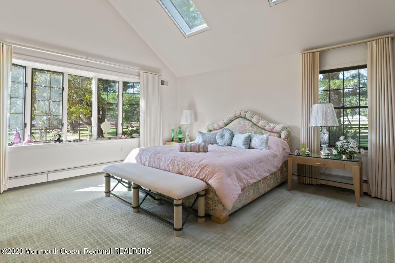 111 Muhlenbrink Road Colts Neck, NJ 07722 - Photo 37 of 73 a bedroom with a bed and a large window