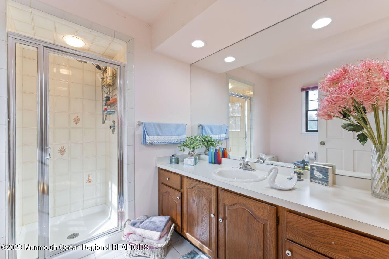 111 Muhlenbrink Road Colts Neck, NJ 07722 - Photo 52 of 73 a bathroom with a double vanity sink mirror and shower