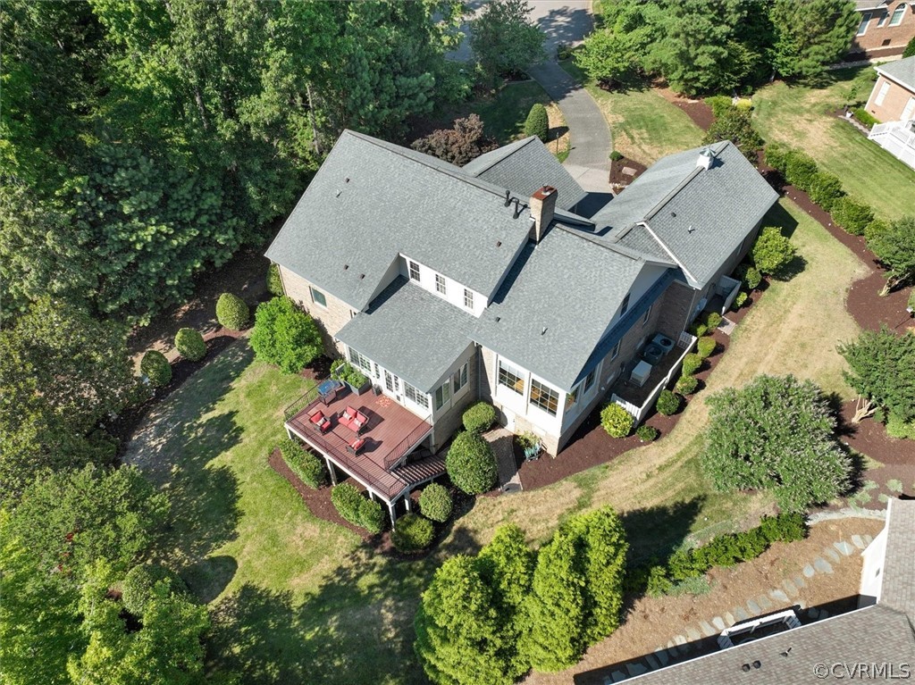 an aerial view of a house with swimming pool and outdoor space