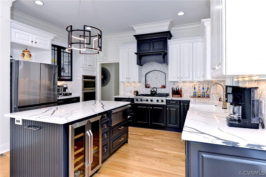 205 Portmarnoch Williamsburg, VA 23188 - Photo 14 of 49 a kitchen with stainless steel appliances kitchen island granite countertop a sink stove and refrigerator