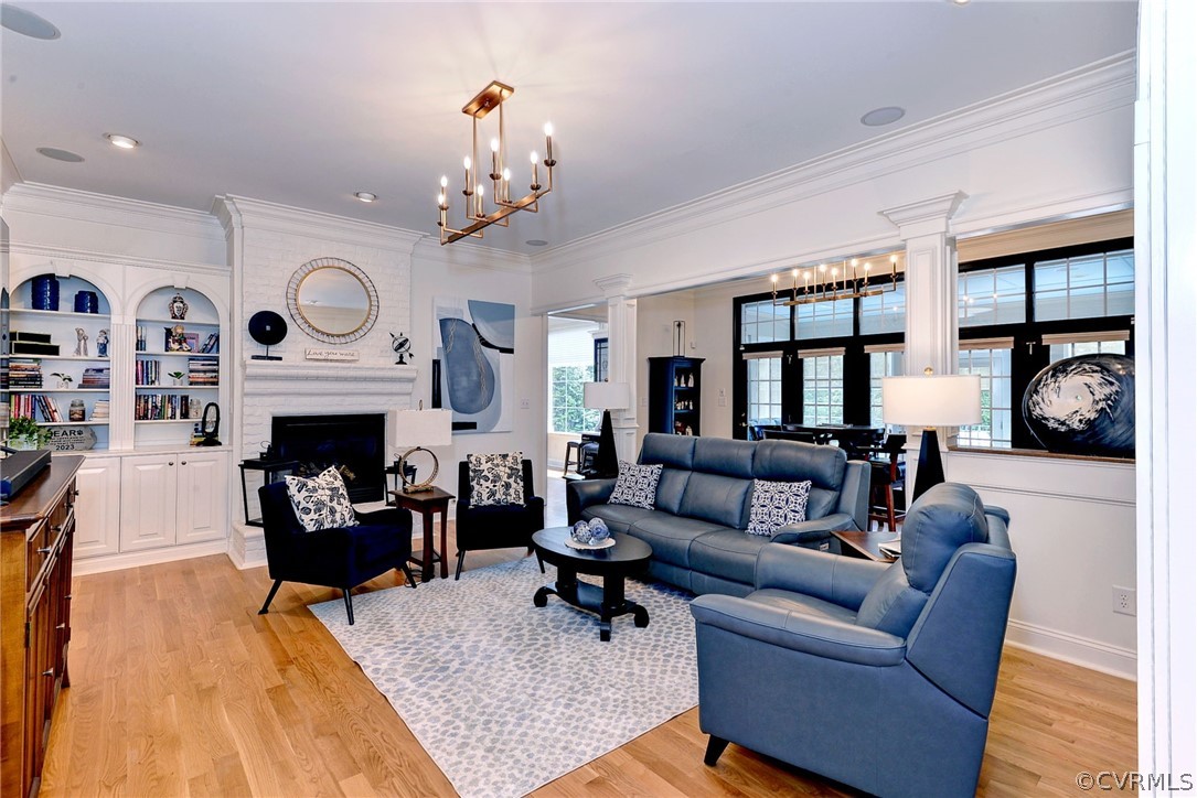 205 Portmarnoch Williamsburg, VA 23188 - Photo 18 of 49 a living room with furniture a fireplace and a flat screen tv