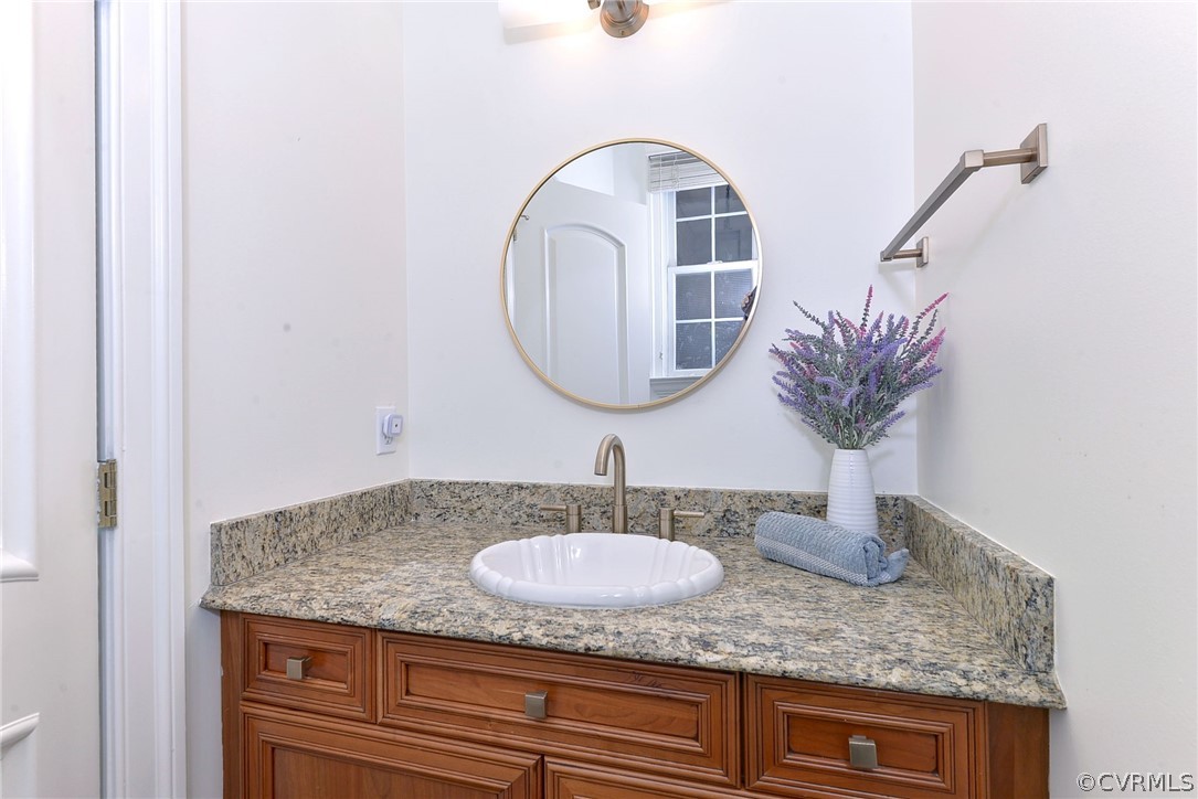 205 Portmarnoch Williamsburg, VA 23188 - Photo 29 of 49 a bathroom with a granite countertop sink and a mirror