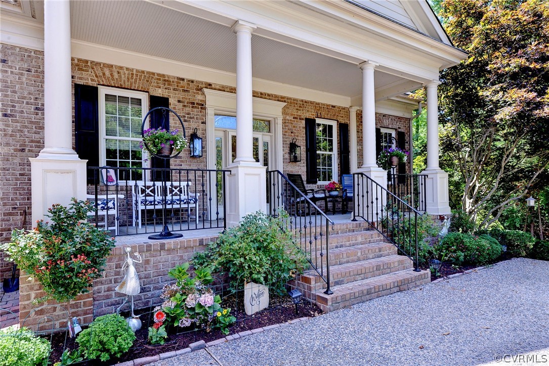 205 Portmarnoch Williamsburg, VA 23188 - Photo 3 of 49 a building outdoor space with patio outdoor seating and plants