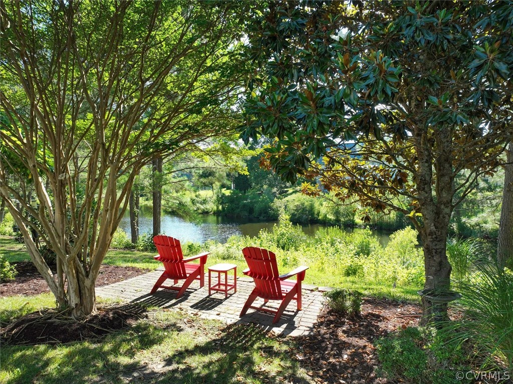 205 Portmarnoch Williamsburg, VA 23188 - Photo 43 of 49 a wooden bench sitting in the middle of a forest