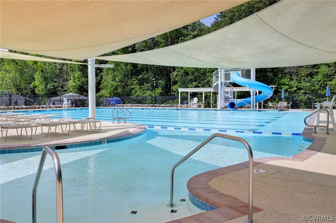 205 Portmarnoch Williamsburg, VA 23188 - Photo 49 of 49 a view of a patio with table and chairs under an umbrella
