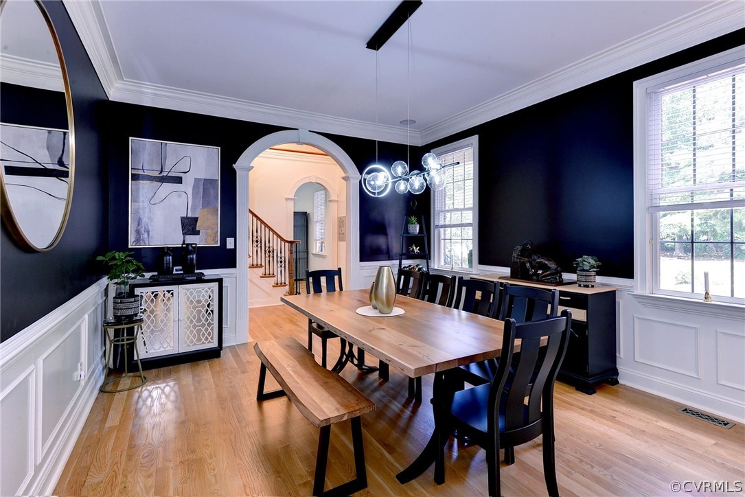 205 Portmarnoch Williamsburg, VA 23188 - Photo 9 of 49 a kitchen with stainless steel appliances granite countertop a stove a sink a dining table and chairs