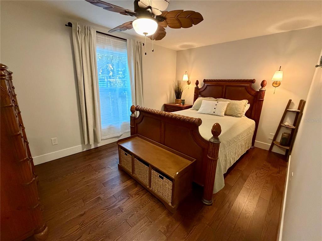 6525 Engram Road New Smyrna Beach, FL 32169 - Photo 13 of 36 a bedroom with bed and wooden floor