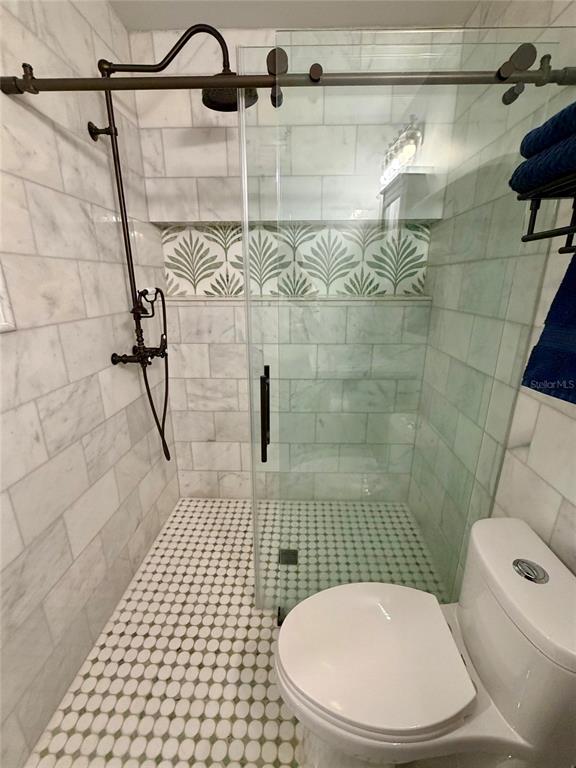 6525 Engram Road New Smyrna Beach, FL 32169 - Photo 14 of 36 a bathroom with a shower