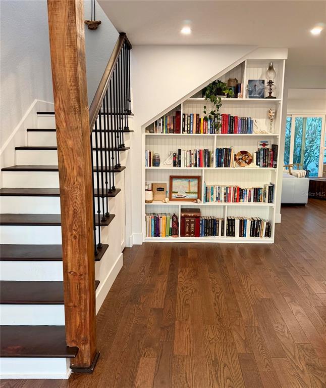 6525 Engram Road New Smyrna Beach, FL 32169 - Photo 6 of 36 a view of an entryway with wooden floor and windows