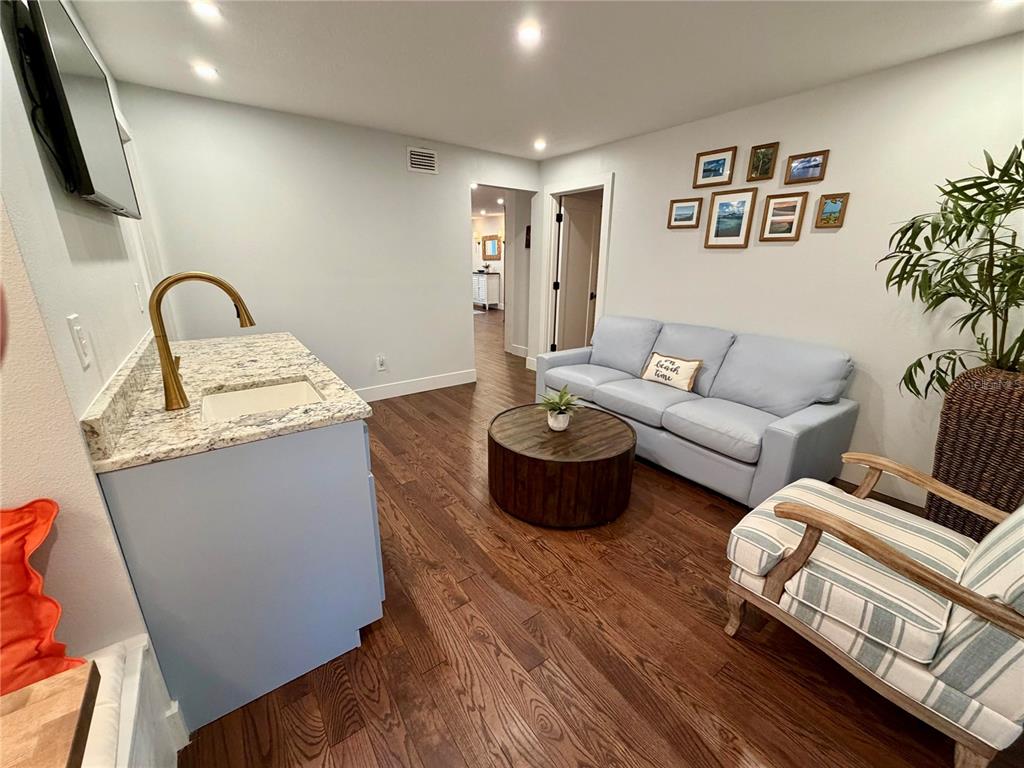 6525 Engram Road New Smyrna Beach, FL 32169 - Photo 7 of 36 a living room with furniture and wooden floor