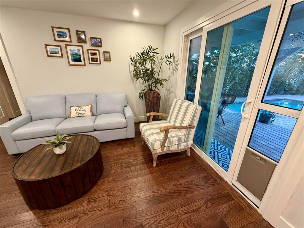 6525 Engram Road New Smyrna Beach, FL 32169 - Photo 8 of 36 a living room with furniture and a large window