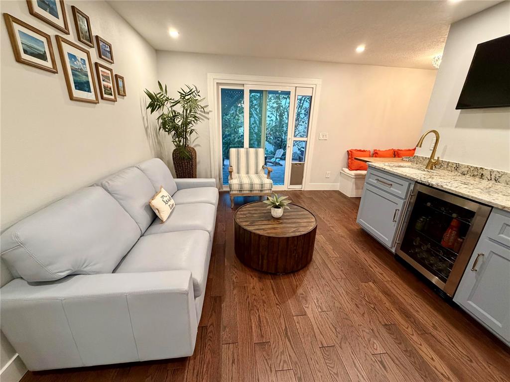 6525 Engram Road New Smyrna Beach, FL 32169 - Photo 9 of 36 a living room with furniture and a fireplace