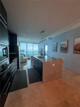a kitchen with a stove and a microwave