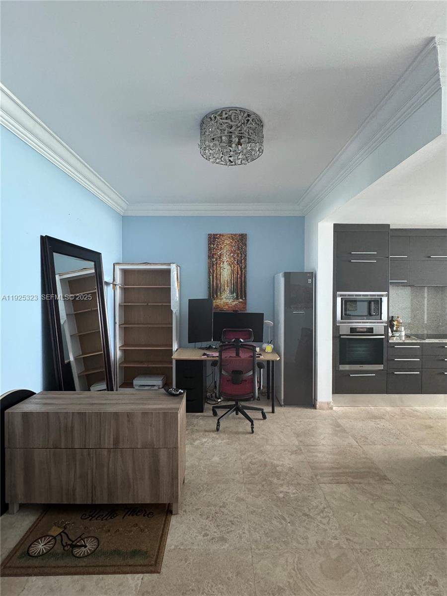 900 Biscayne Boulevard, Unit 2604 Miami, FL 33132 - Photo 40 of 59 a living room with furniture and a flat screen tv