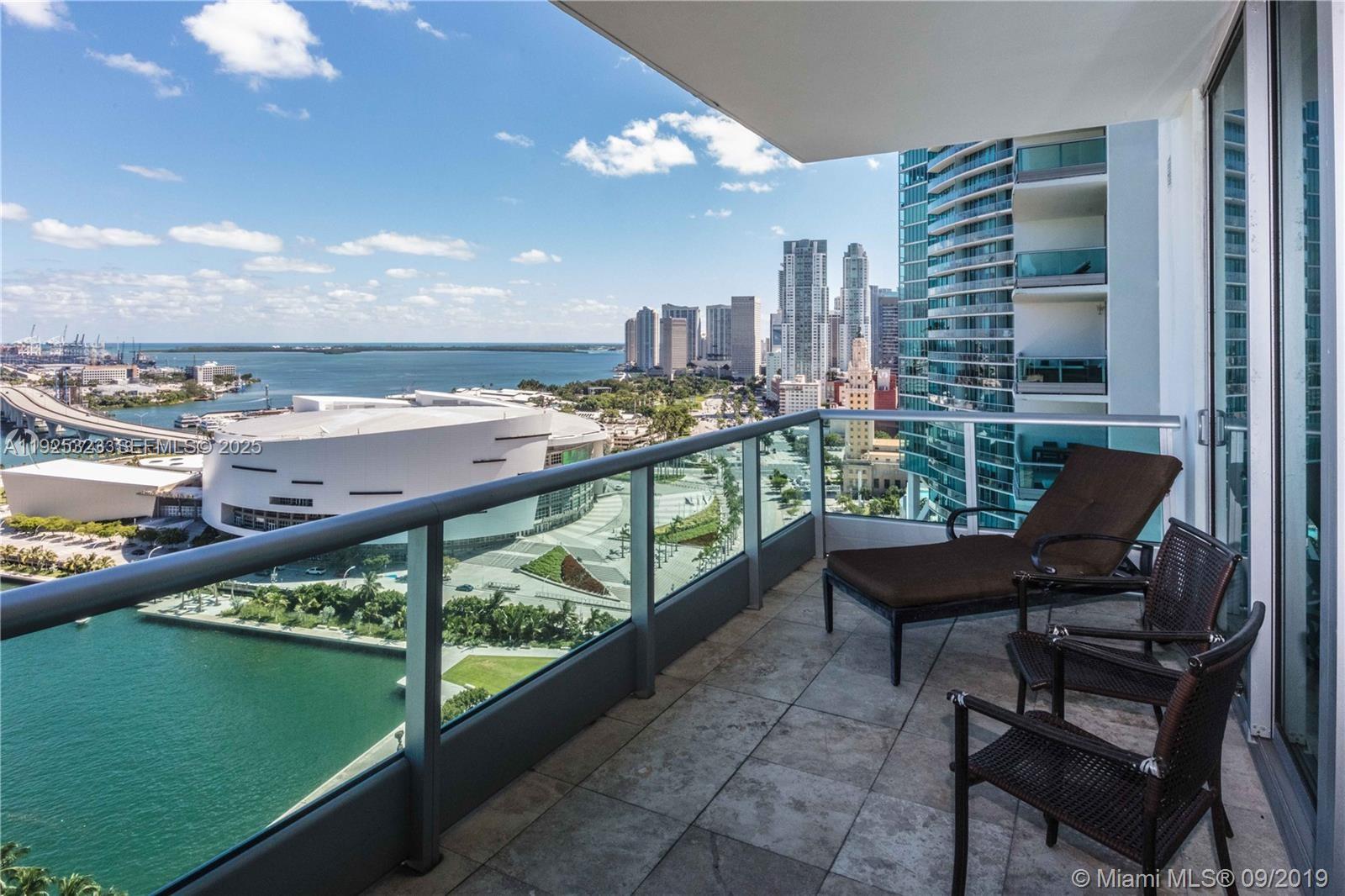 900 Biscayne Boulevard, Unit 2604 Miami, FL 33132 - Photo 4 of 59 a view of a chairs and table in a balcony