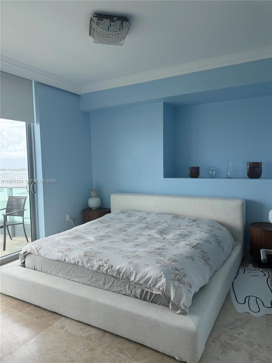 900 Biscayne Boulevard, Unit 2604 Miami, FL 33132 - Photo 44 of 59 a bedroom with a bed and a window