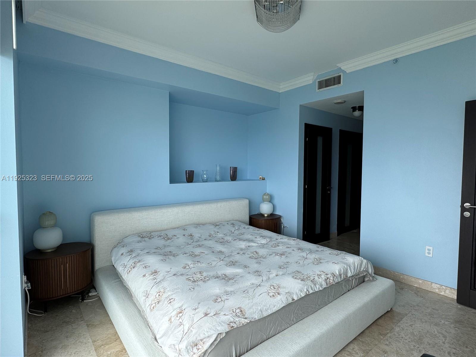 900 Biscayne Boulevard, Unit 2604 Miami, FL 33132 - Photo 45 of 59 a bedroom with a bed and a window