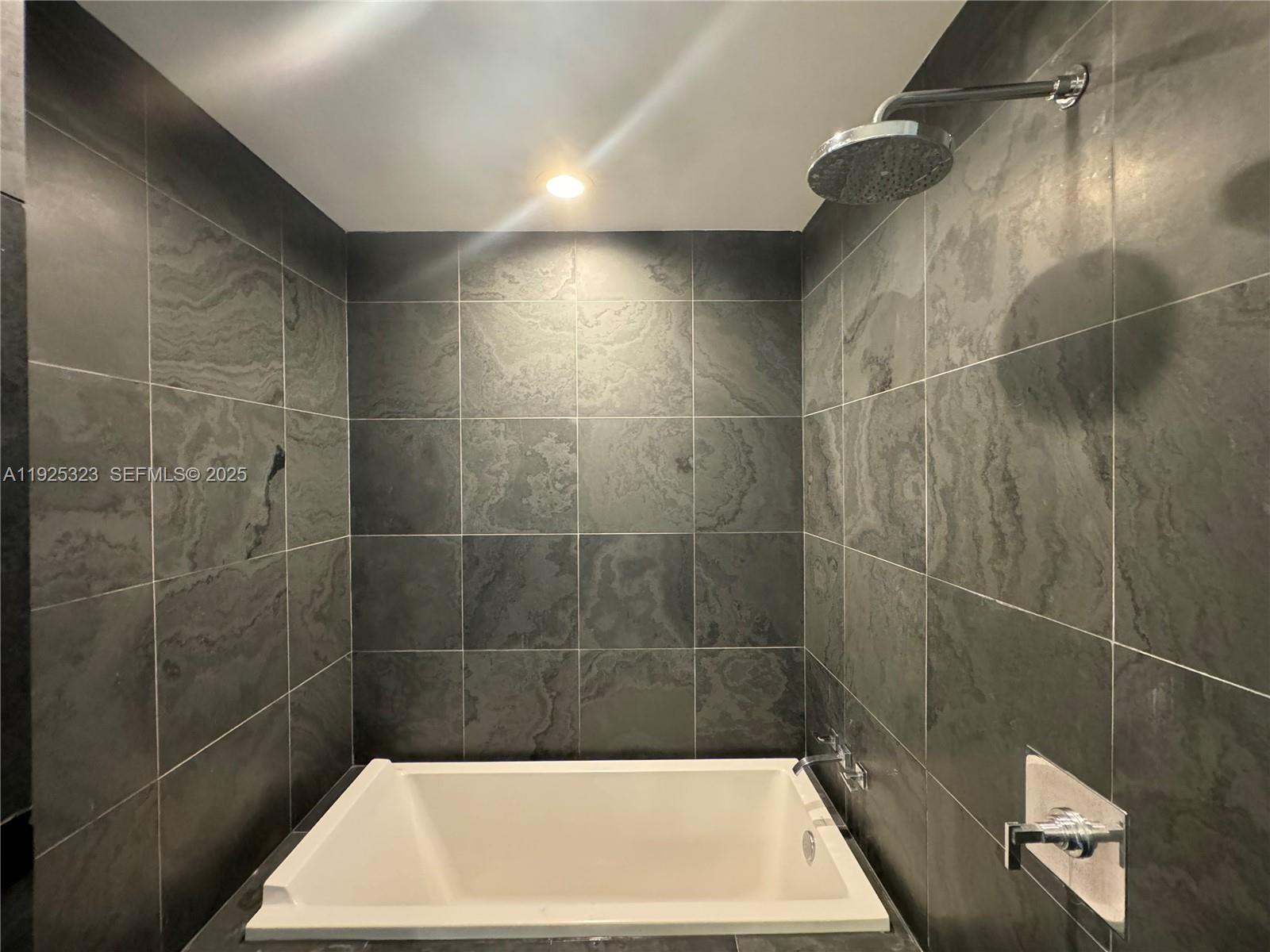 900 Biscayne Boulevard, Unit 2604 Miami, FL 33132 - Photo 53 of 59 a bathroom with a shower