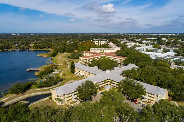 a view of a lake with houses in the back