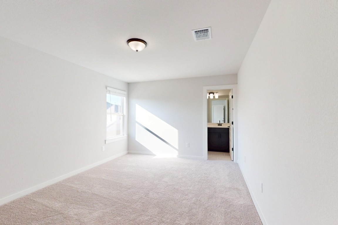 3965 Waco Way Leander, TX 78641 - Photo 21 of 38 a view of an empty room with a window