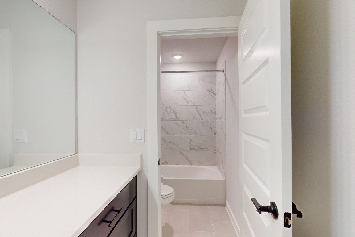 3965 Waco Way Leander, TX 78641 - Photo 30 of 38 a bathroom with a bathtub