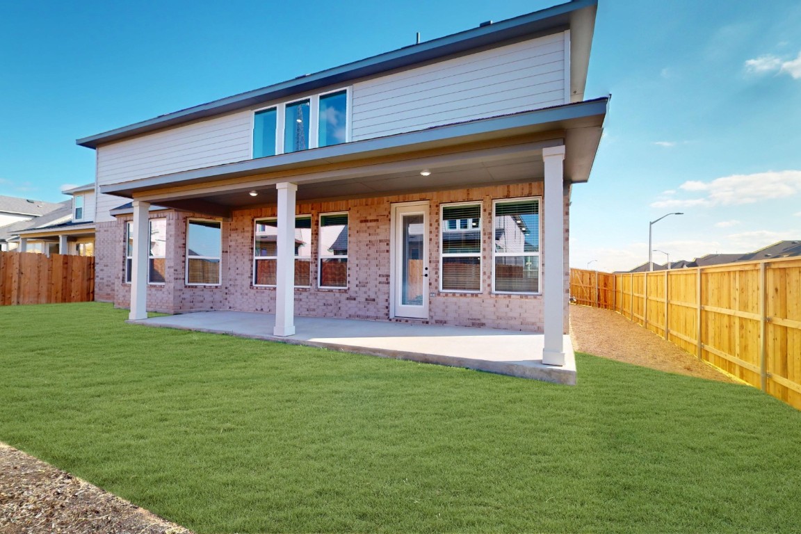 3965 Waco Way Leander, TX 78641 - Photo 36 of 38 a view of a house with a yard