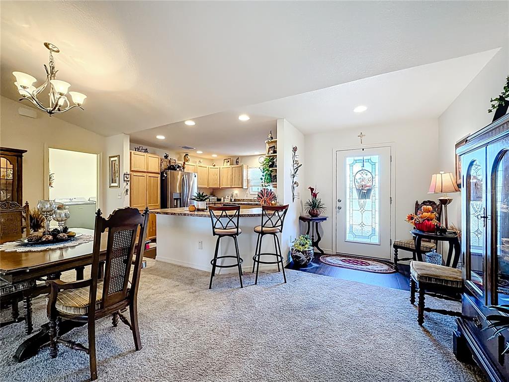 3531 Thorne Path Oxford, FL 34484 - Photo 18 of 56 a view of a dining room with furniture and a livingroom
