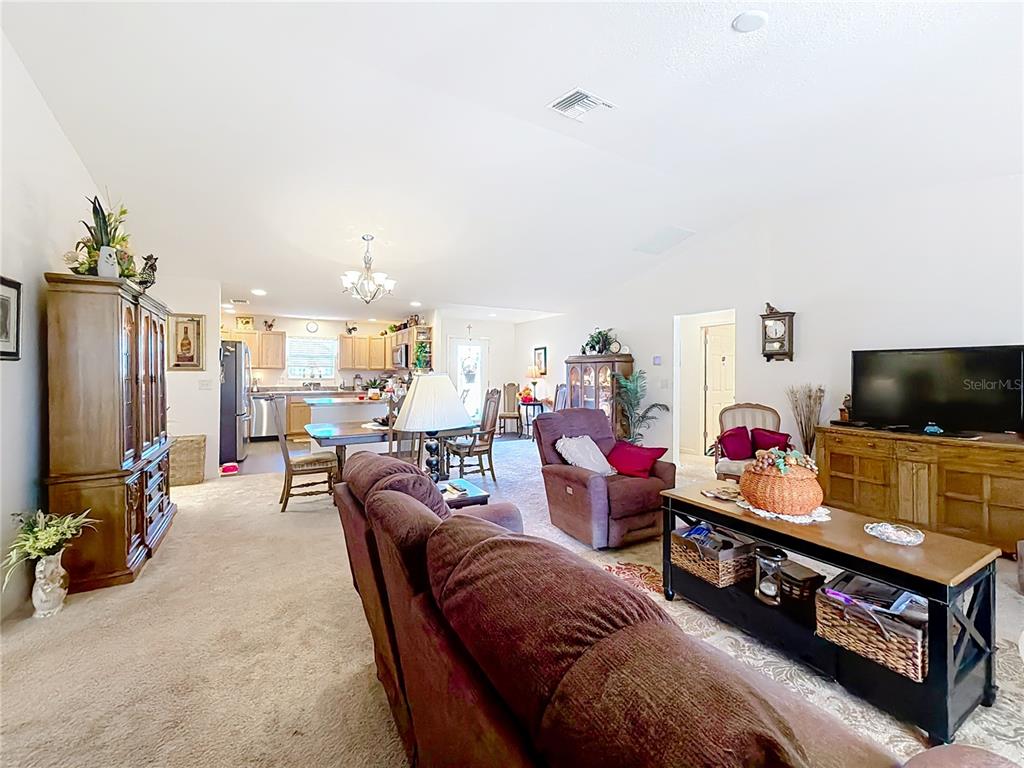 3531 Thorne Path Oxford, FL 34484 - Photo 24 of 56 a living room with furniture and a flat screen tv