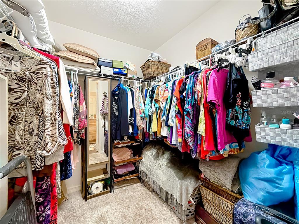 3531 Thorne Path Oxford, FL 34484 - Photo 37 of 56 a view of walk in closet with clothes