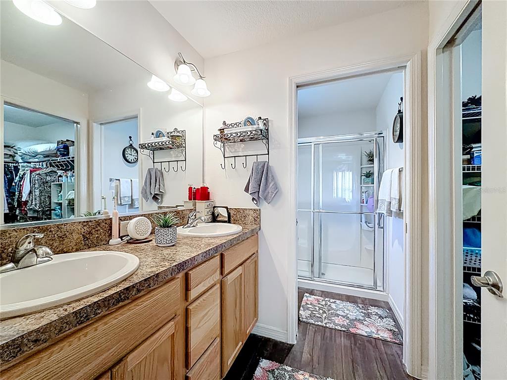 3531 Thorne Path Oxford, FL 34484 - Photo 38 of 56 a bathroom with a sink double vanity and shower
