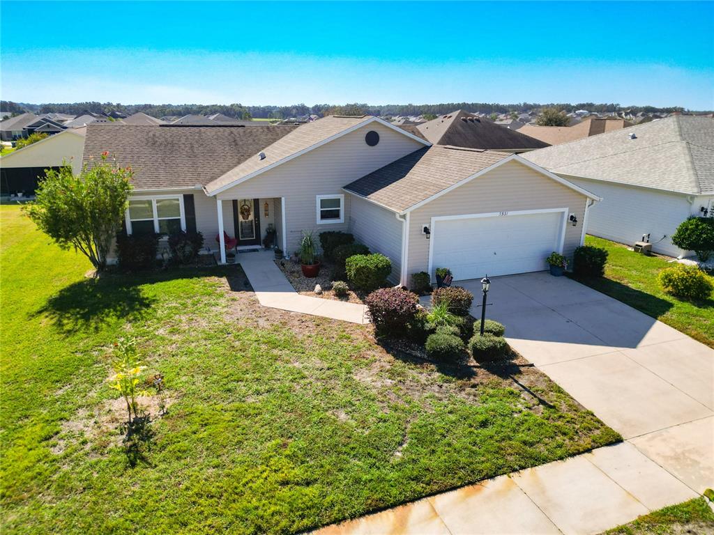 3531 Thorne Path Oxford, FL 34484 - Photo 4 of 56 a view of a house with a yard and potted plants