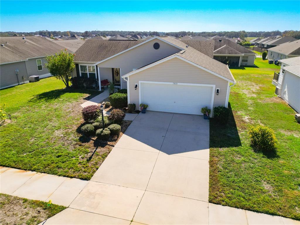 3531 Thorne Path Oxford, FL 34484 - Photo 5 of 56 an aerial view of a house with a yard