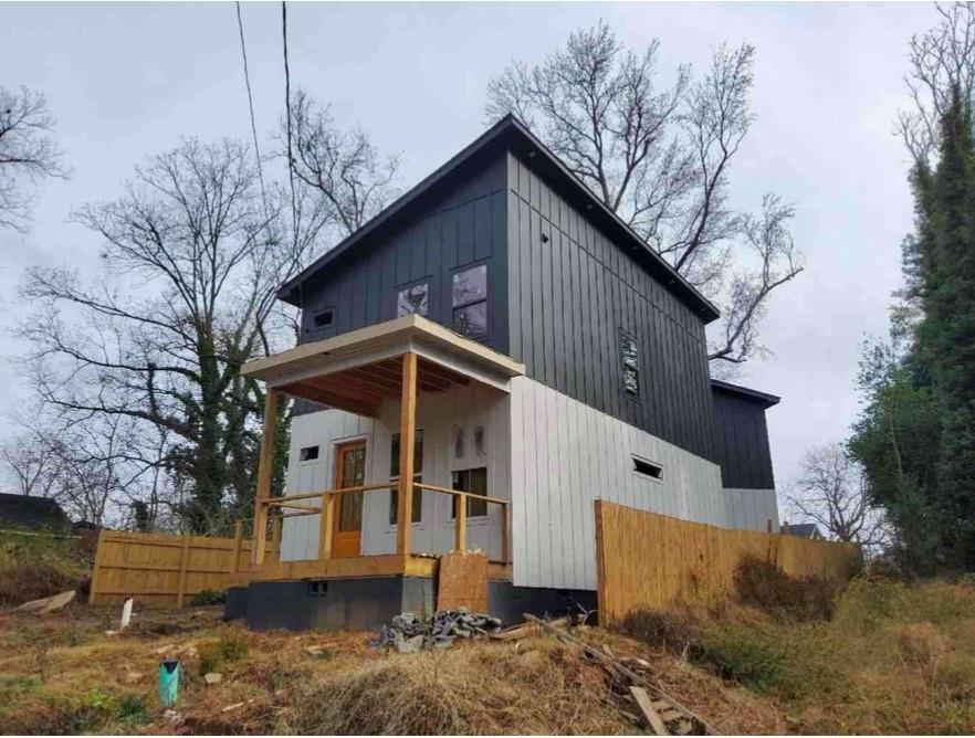 1148 Welch Street Southwest Atlanta, GA 30310 - Photo 2 of 4 a front view of a house with a yard