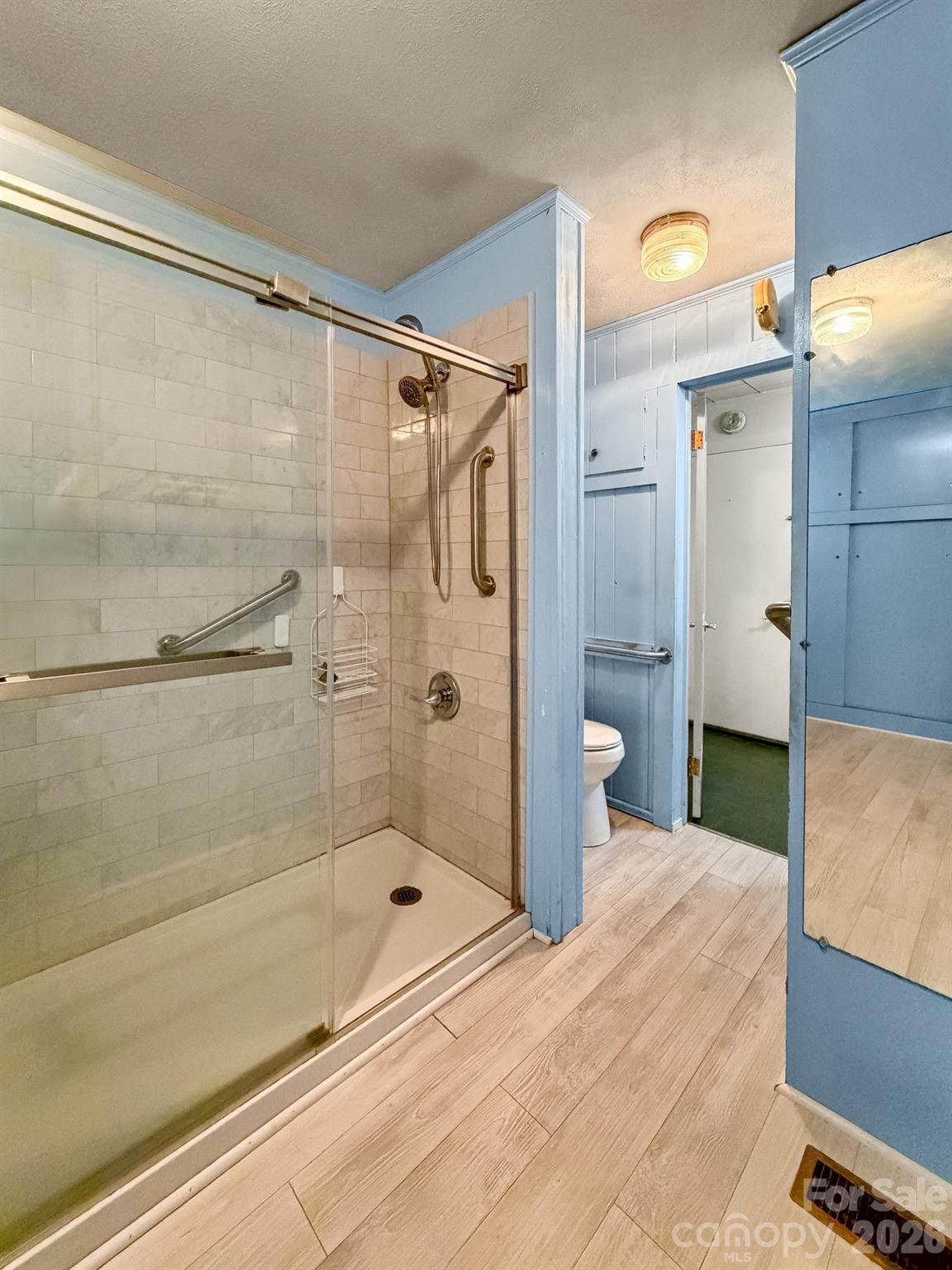 1401 East Union Street Morganton, NC 28655 - Photo 18 of 40 a bathroom with a shower and a bathtub