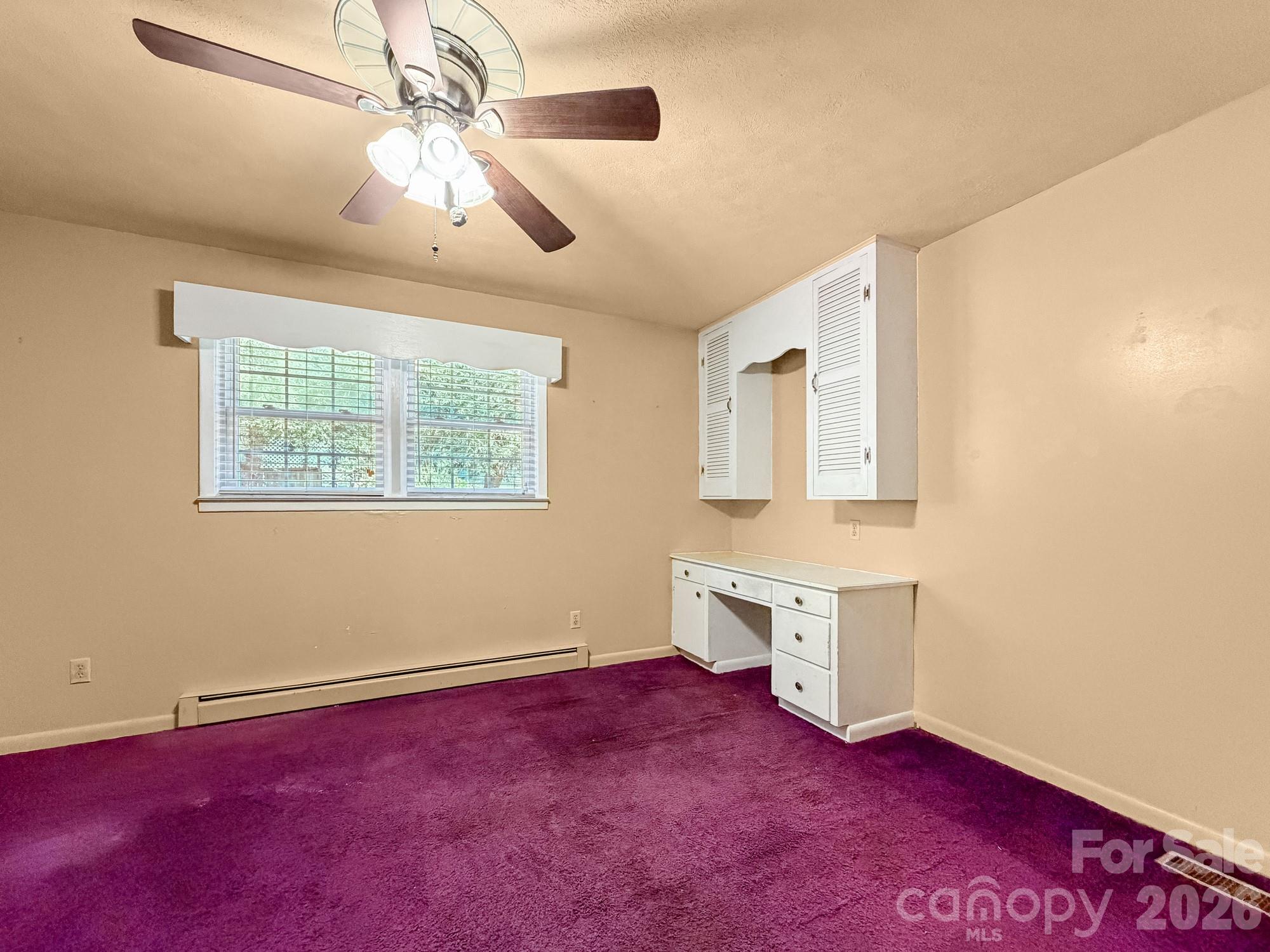 1401 East Union Street Morganton, NC 28655 - Photo 28 of 40 a view of an empty room with window and wooden floor