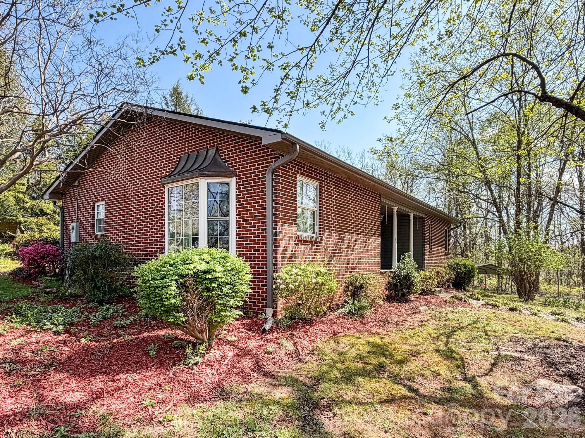 1401 East Union Street Morganton, NC 28655 - Photo 3 of 40 a front view of a house with garden