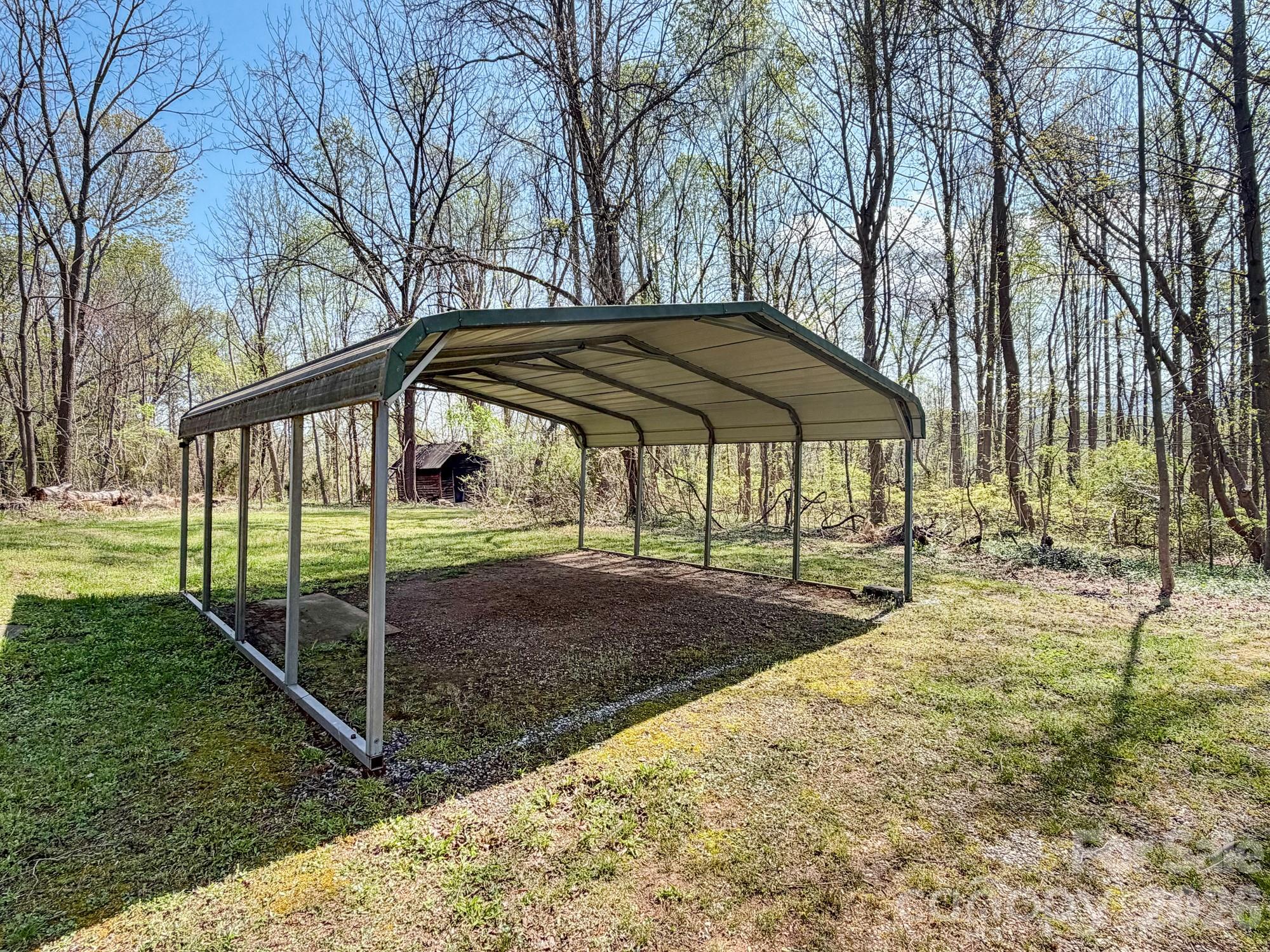 1401 East Union Street Morganton, NC 28655 - Photo 33 of 40 a backyard of a house with table and chairs