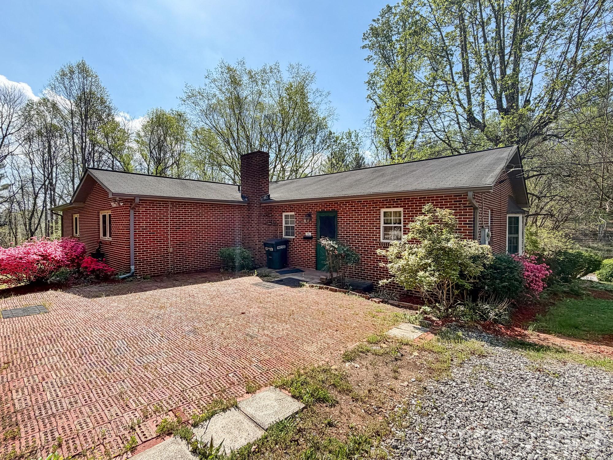 1401 East Union Street Morganton, NC 28655 - Photo 7 of 40 a front view of a house with a yard and garage