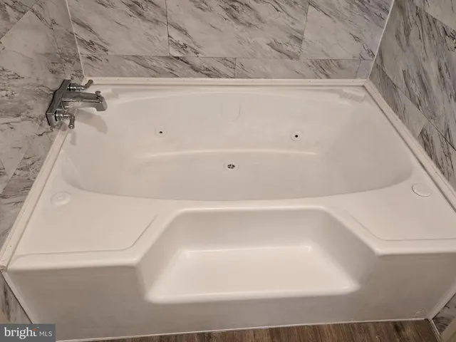 a view of a bathtub in bathroom