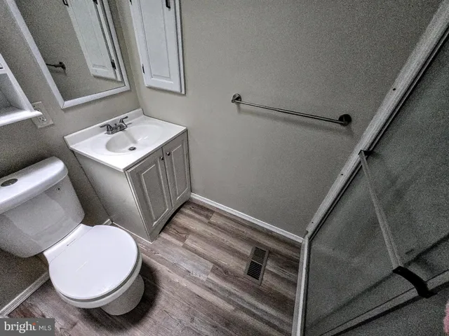 a bathroom with a sink toilet and vanity