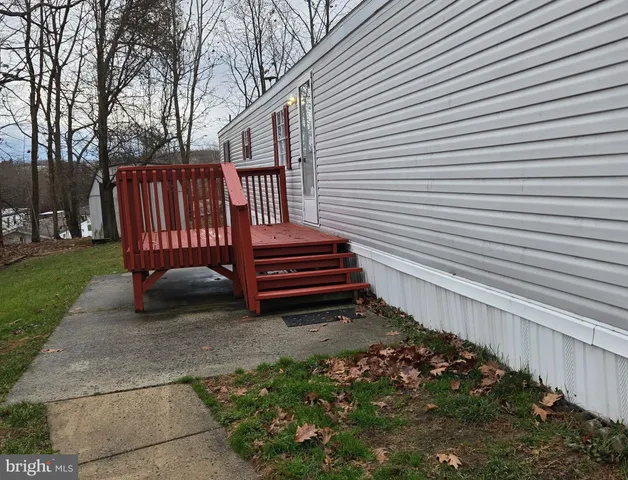 a view of a backyard with wooden fence