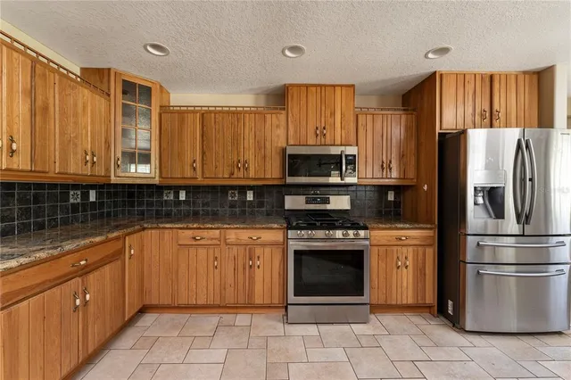 a view of a kitchen and a window